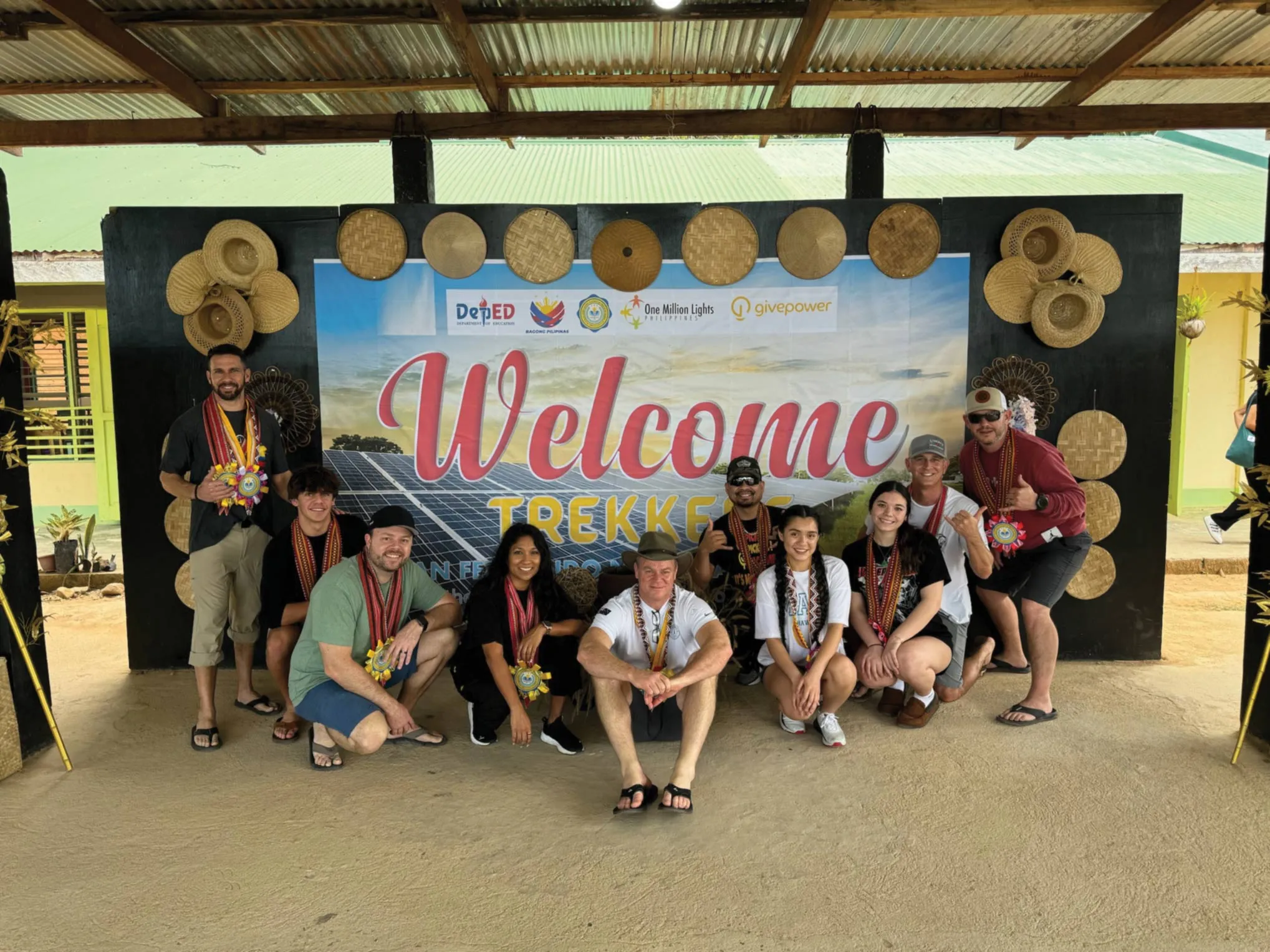 Volunteers and students at a partnership project site
